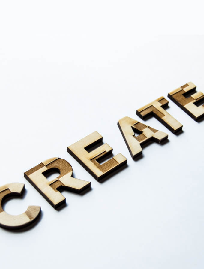 Wood pieces spelling the word "create"