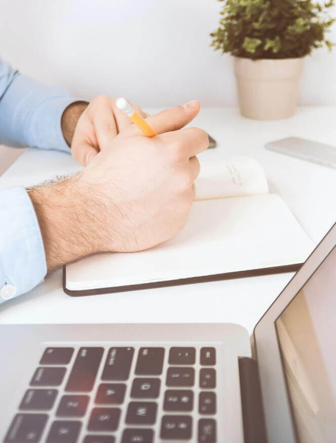 Accountant taking notes from client brief