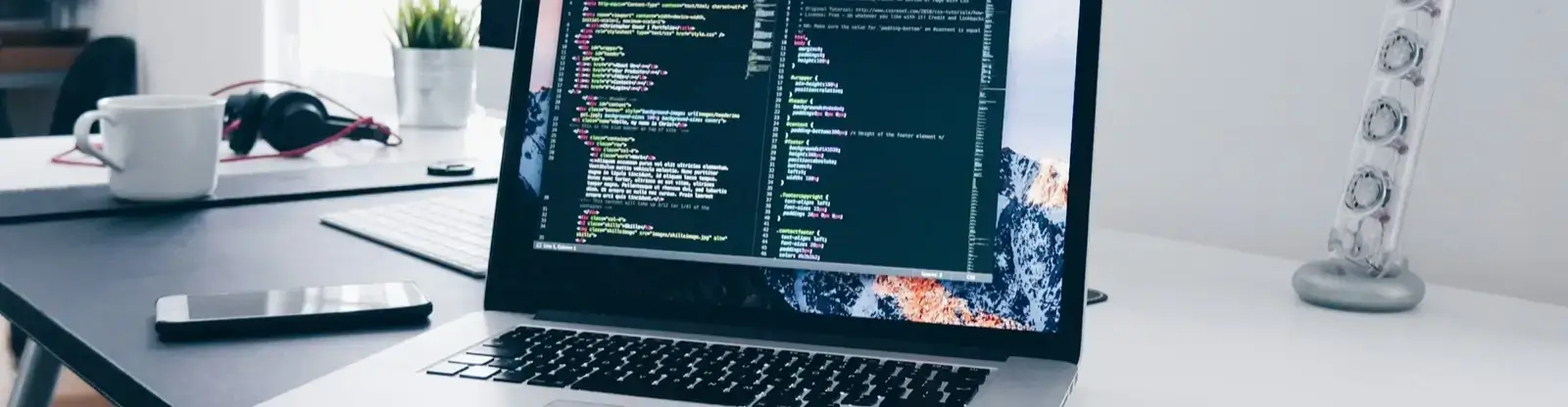 Why Bespoke WordPress Themes Outperform Page Builders Web developer writing code on laptop in modern workspace